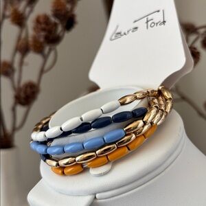 Laura Ford Goldtone 5 Row Rice bead, blues,white, mustard,chunky stretch